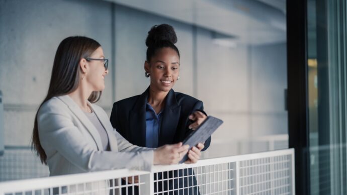 Two professionals reviewing workforce planning information for clean tech skills development