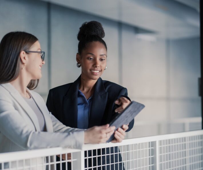 Two professionals reviewing workforce planning information for clean tech skills development